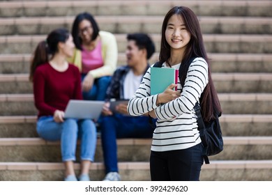 Group Of Happy Teen High School Students Outdoors