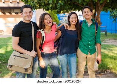 Group Of Happy Teenage Friends Hanging Out And Having Fun After School