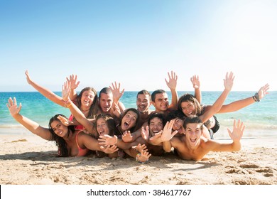 Group Of Happy Teens At The Beach