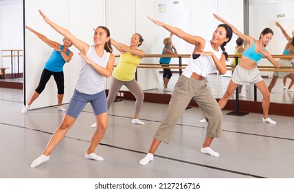 Group Of Happy Women Different Ages Practicing Modern Zumba In Dance Class