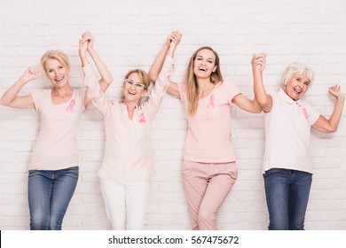 Group of happy women winning the struggle with breast cancer