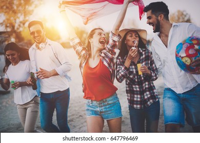 Group Of Happy Young People Enjoying Summer Vacation