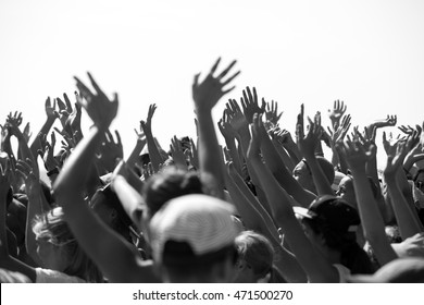 Group Of Happy Young People With Hands Up To The Sky, Black And White