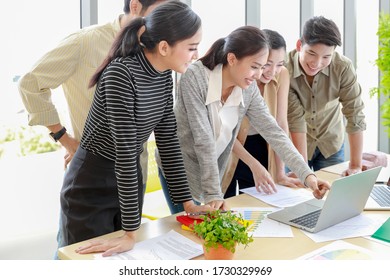 Group Of Happy Young Professional Asian Business People Team Meeting Talking And Sharing Their Ideas In Modern Office, Working, Design And Planning For Next Quarter.