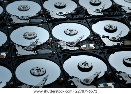 Group of hard disk drives. Many Open Hard drives. Close-up of the inside of PC hard drives. Technology background. Selective focus