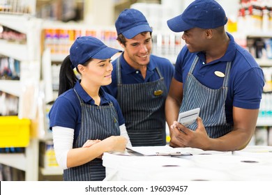 group of hardware store workers discussing work