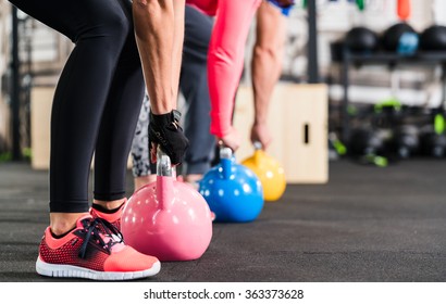 Group having functional fitness training with kettlebell in sport gym - Shutterstock ID 363373628