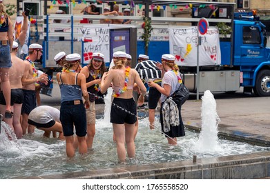 Group Of High School Students In A Fountain Celebrating Finishing High School In Aarhus, Denmark On 27 June 2020