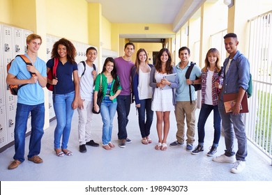 Group Of High School Students Standing In Corridor