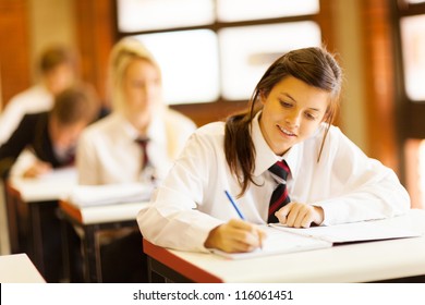 Group Of High School Students Studying In Classroom