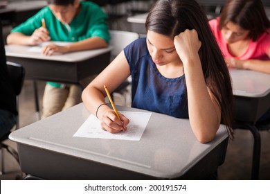 Group of high school students taking a test in a classroom