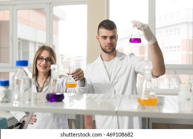 Group Of High School Students Working Together At Laboratory Class