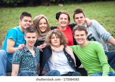 Group Of Highschool Students Posing Outside In A Park