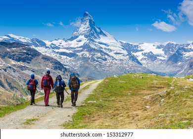 Group Of Hikers In The Mountain 