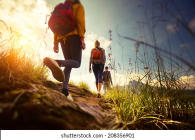 Group of hikers walking in mountains. Edges of the image are blurred - Shutterstock ID 208356901