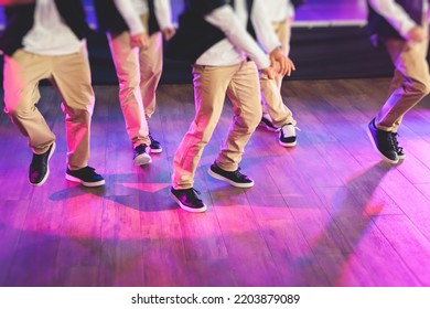 Group Of Hip-hop Dancers Performance On A Stage, Modern Contemporary Street Dance With Break Dancing In Studio, Hip Hop Dance Training  In A Ballroom, Legs In Sneakers Close Up