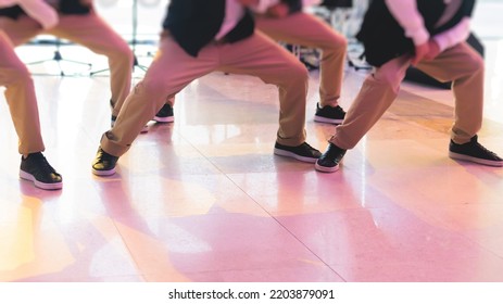 Group Of Hip-hop Dancers Performance On A Stage, Modern Contemporary Street Dance With Break Dancing In Studio, Hip Hop Dance Training  In A Ballroom, Legs In Sneakers Close Up