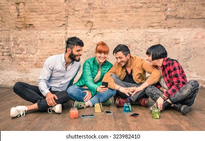 Group Of Hipster Best Friends With Smartphones In Grungy Alternative Location - Young Entrepreneurs People Resting At Cocktail Bar Renovation - Friendship Fun Concept With Trend Technology Interaction