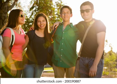 Group Of Hispanic High School Students Having Fun Outdoors