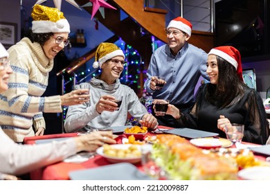 Group Of Hispanic Latin People Social Gathering For New Year Dinner - Multi Generational Family Celebrating Christmas Holidays