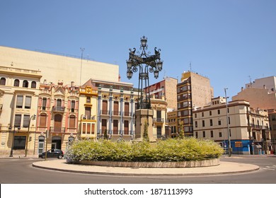 Group Of Historic Modernist Buildings A Intricately Designed Street Lamp Called La Farola From 1929, City Of Castellón, Valencia, Spain.