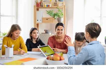 Group Of Homeschooling Children With Teacher Studying Indoors, Coronavirus Concept.