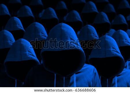 Group of hooded hackers with side light in blue cybersecurity concept Stock photo © 