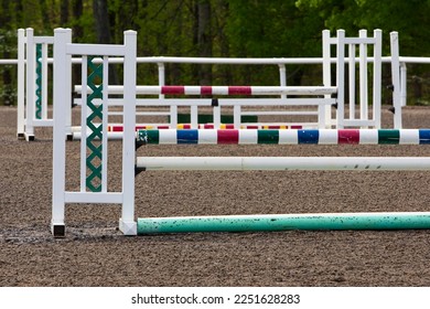 A group of horse jumps in an equestrian ring before a local show - Shutterstock ID 2251628283