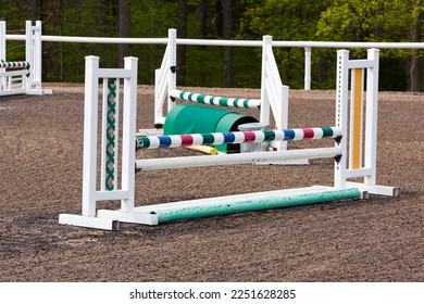 A group of horse jumps in an equestrian ring before a local show - Shutterstock ID 2251628285