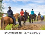 Group of horseback riders ride  in Iceland