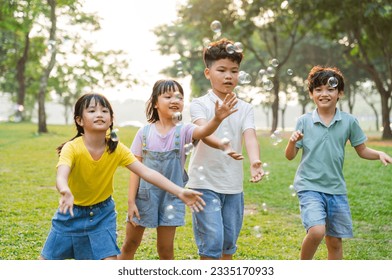 group image of cute asian children playing in the park - Powered by Shutterstock