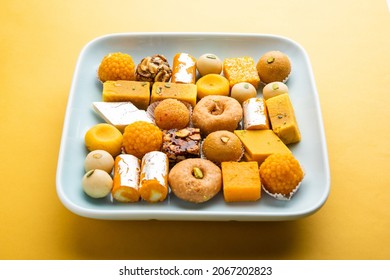 Group Of Indian Assorted Sweets Or Mithai With Diya