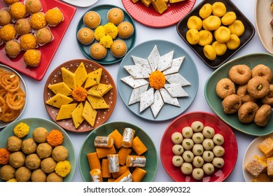 Group Of Indian Assorted Sweets Or Mithai With Diya
