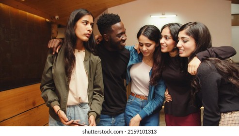 A Group Of Indian Friends Having Fun Inside A Cafe