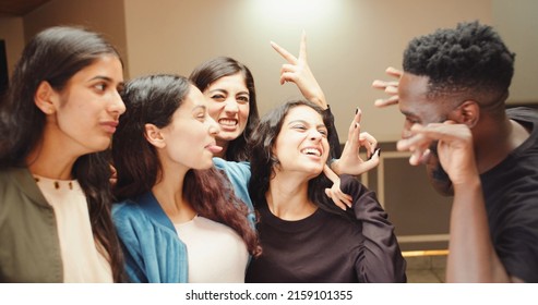 A Group Of Indian Friends Having Fun Inside A Cafe