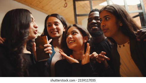 A Group Of Indian Friends Having Fun Inside A Cafe