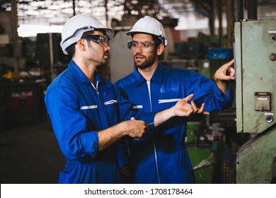 Group Of Industrial Factory Maintenance Engineers Inspect Relay Protection System Of Machinery. Industry, Maintenance, Engineering And Construction Concept.