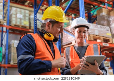 Group of Industrial worker working at warehose factory.