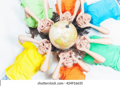 Group Of International Funny Kids With Globe Earth.