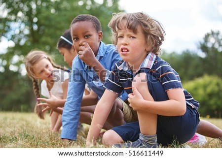 Group of interracial kids at a race at the park