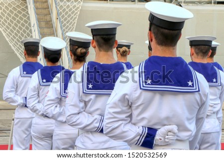 Group of Italian sailors from behind