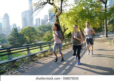 Group Of Joggers Exercising At Central Park, NYC