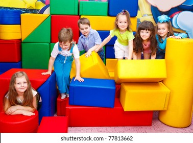 Group Of Joyful Kids Playing With Large Leather Blocks