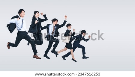 A group of  jumping young business people.