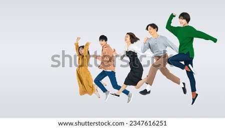 A group of  jumping young people on white background.