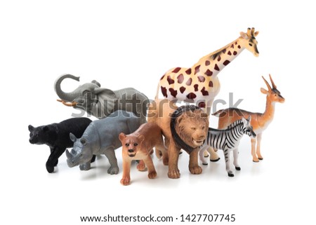 Group of jungle animals toys isolated over white background. Plastic animals toys.