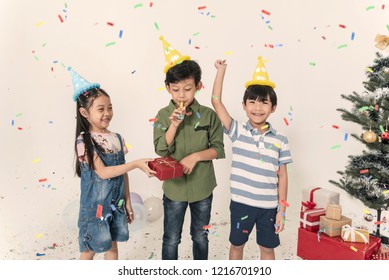 Group Of Kids Celebrate Christmas And Happy New Year Party Together.