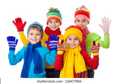 Group Of Kids In Colorful Winter Clothes, Isolated On White