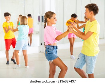 Group Of Kids Formed Couples And Dancing Salsa During Rehearsal.