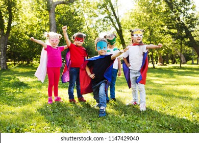 Group Kids Friends  Superhero Playing Togetherness And Having Fun Outdoor.
